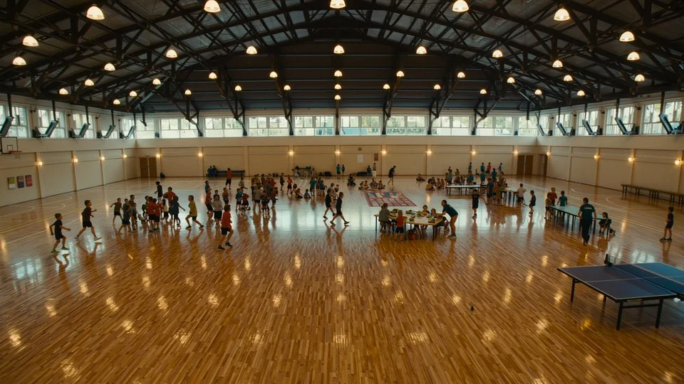 Busy activity hall full of children at summer camp